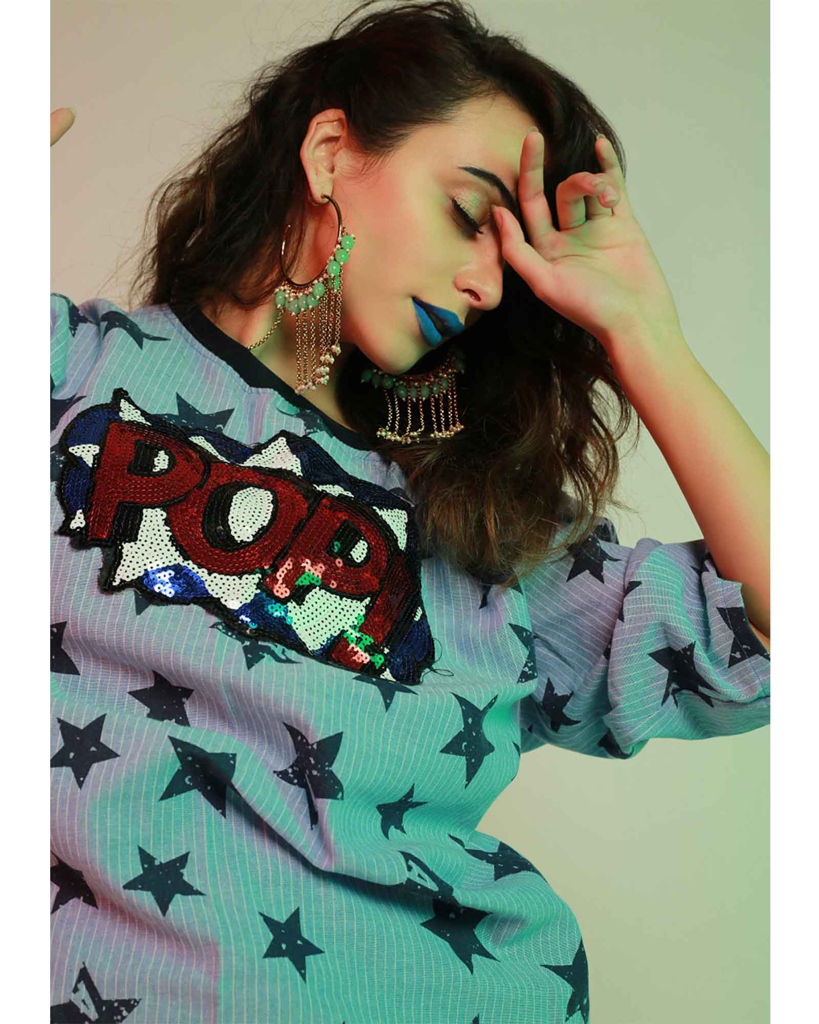 Handcrafted gold hoops adorned with chains and beads