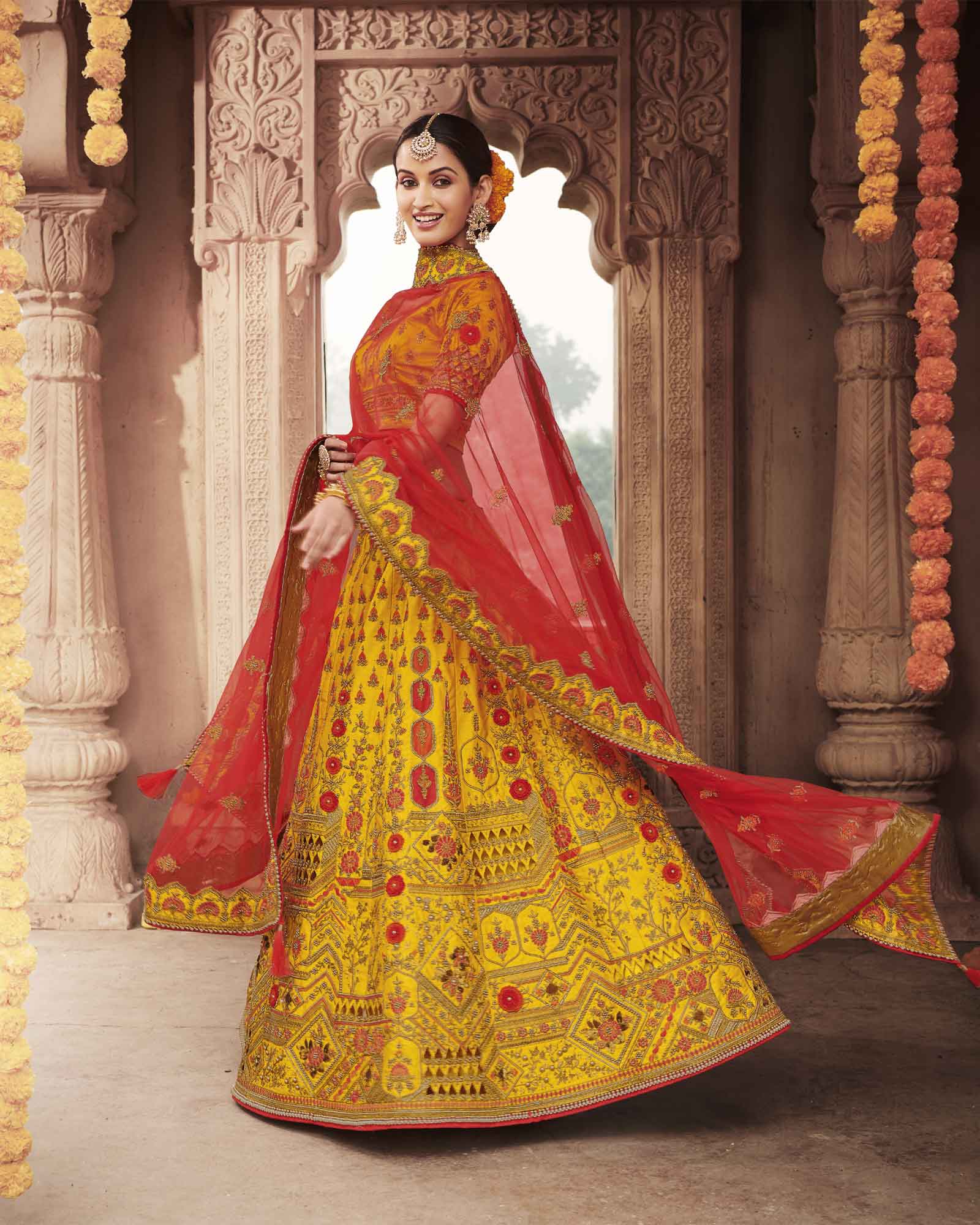 Yellow Silk Bridal Lehenga Choli With Heavy Thread Embroidery And Stone Work